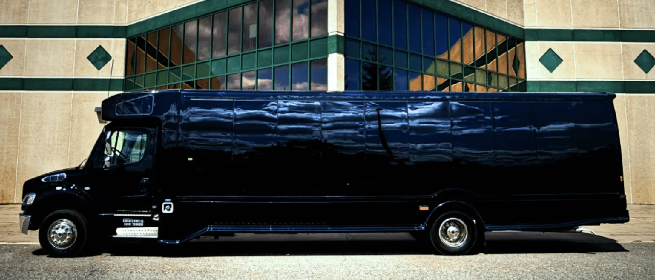 Black 28 Passenger Party Bus exterior with tinted windows for party bus rental