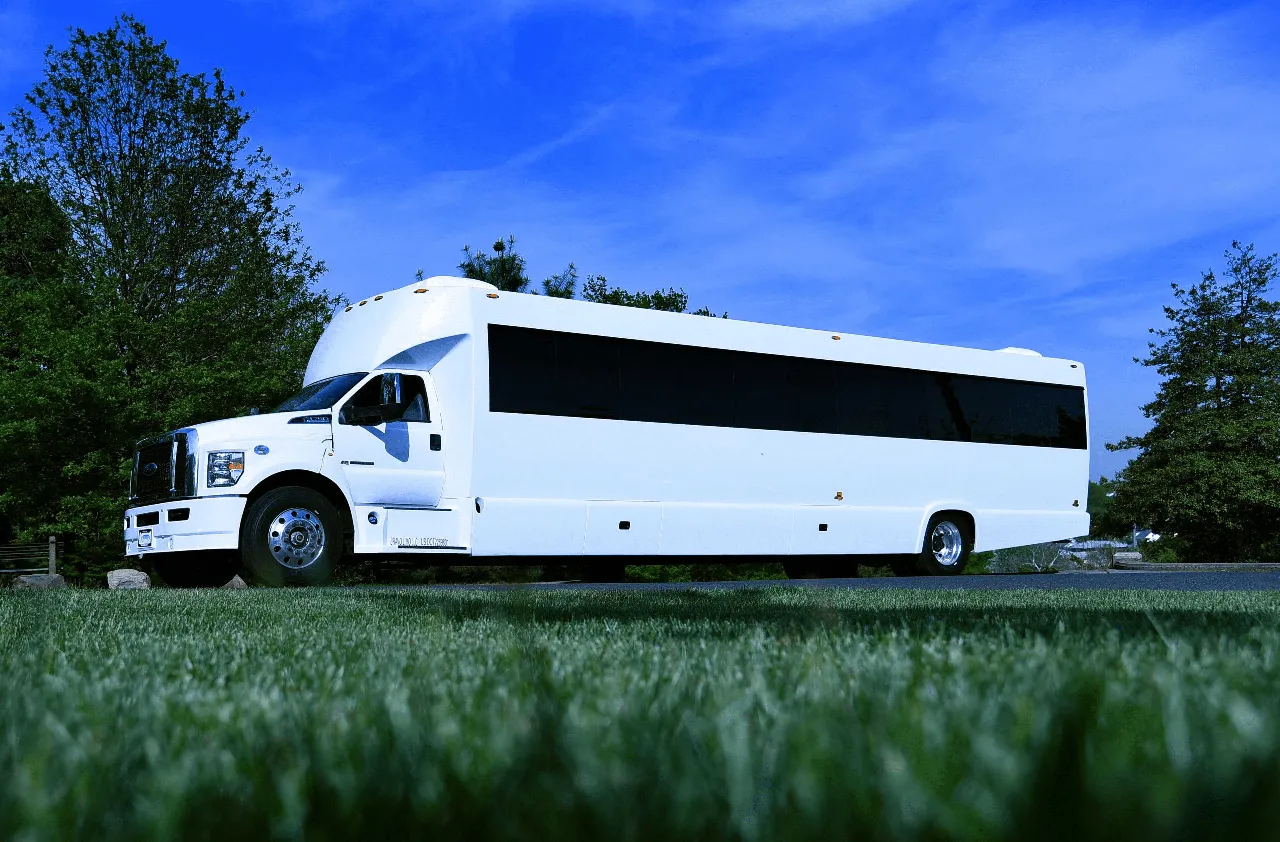 White 50 Passenger Party Bus exterior with tinted windows for party bus rental