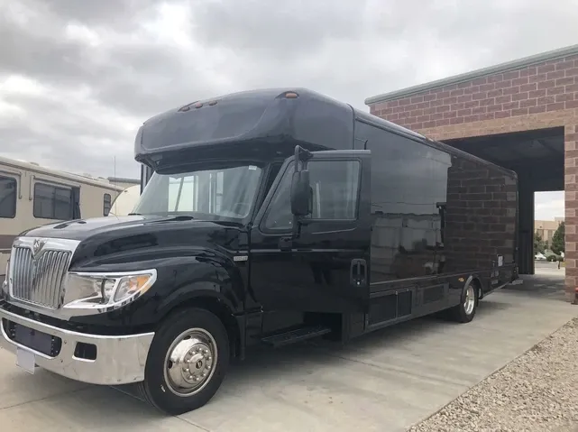 28 Passenger Party Bus, black – for rent