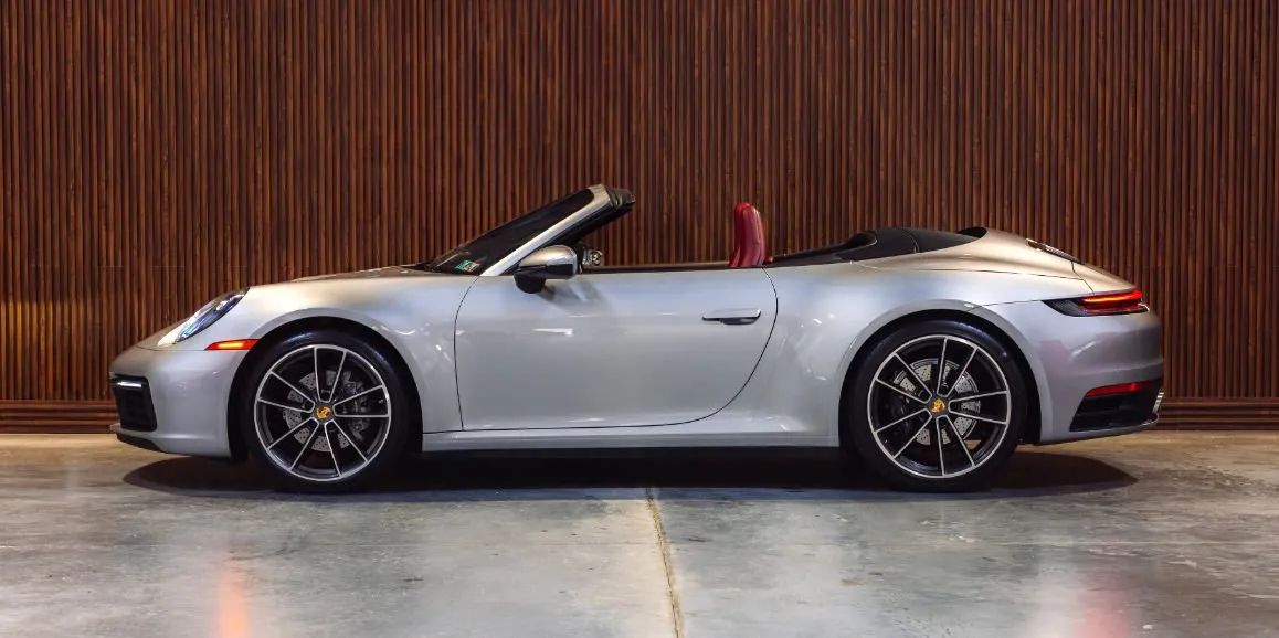 Silver Porsche 911 exterior with convertible roof for sports car rental