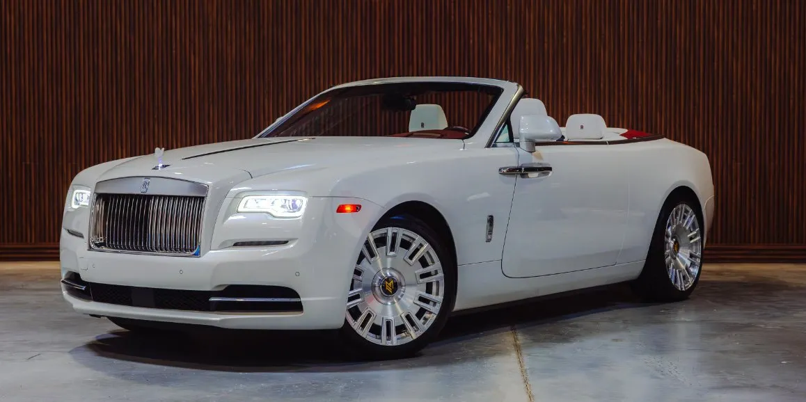 White Rolls Royce Dawn with convertible roof for wedding car rental