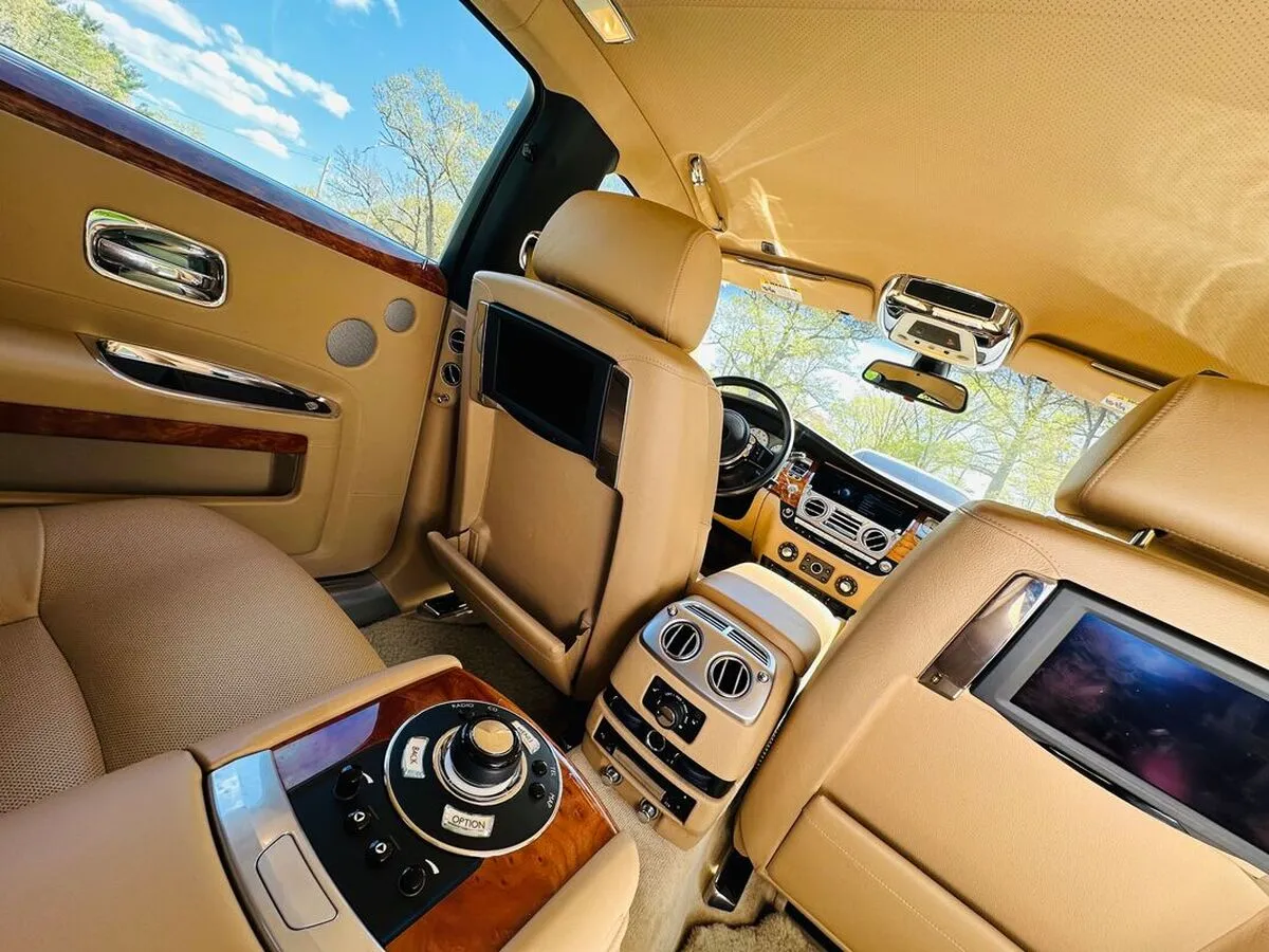 Rolls Royce Ghost Sedan interior with rear-seat entertainment screens for wedding car rental